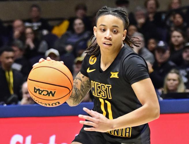 WVU WBB 1115 JJ Quinerly dribbles closeup front